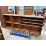 A MAHOGANY CABINET WITH TWELVE SHELVES