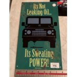 A 'IT'S NOT LEAKING OIL IT IS SWEATING POWER' METAL ADVERTISING SIGN