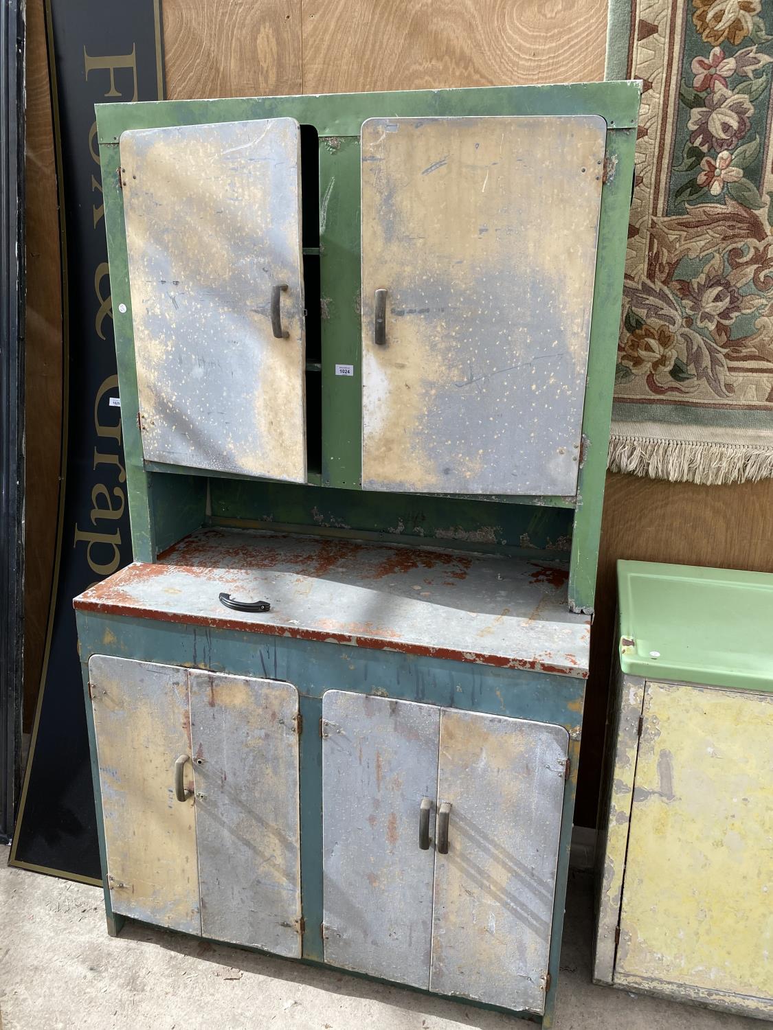 A VINTAGE ALUMINIUM KITCHEN DRESSER WITH FOUR LOWER AND TWO UPPER DOORS