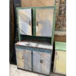 A VINTAGE ALUMINIUM KITCHEN DRESSER WITH FOUR LOWER AND TWO UPPER DOORS