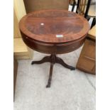 A SMALL MAHOGANY DRUM TABLE