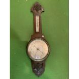 AN EARLY 20TH CENTURY OAK BAROMETER