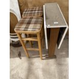 A RETRO TEAK DROP LEAF KITCHEN TABLE AND TWO KITCHEN STOOLS