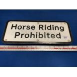 A HORSE RIDING PROHIBITED SIGN