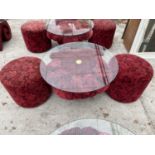A RED ROSE PATTERNED GLASS TOP TABLE AND TWO MATCHING STOOLS