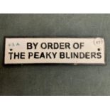 A VINTAGE STYLE REPRODUCTION CAST METAL 'BY ORDER OF THE PEAK BLINDERS' SIGN