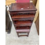 AN ORIENTAL STYLE MAHOGANY NEST OF FOUR TABLES