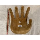 A LARGE WOODEN HAND