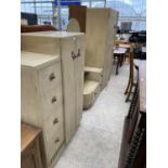 A LIMED OAK ART DECO STYLE THREE PIECE BEDROOM SUITE - A TALLBOY, DRESSING TABLE AND WARDROBE