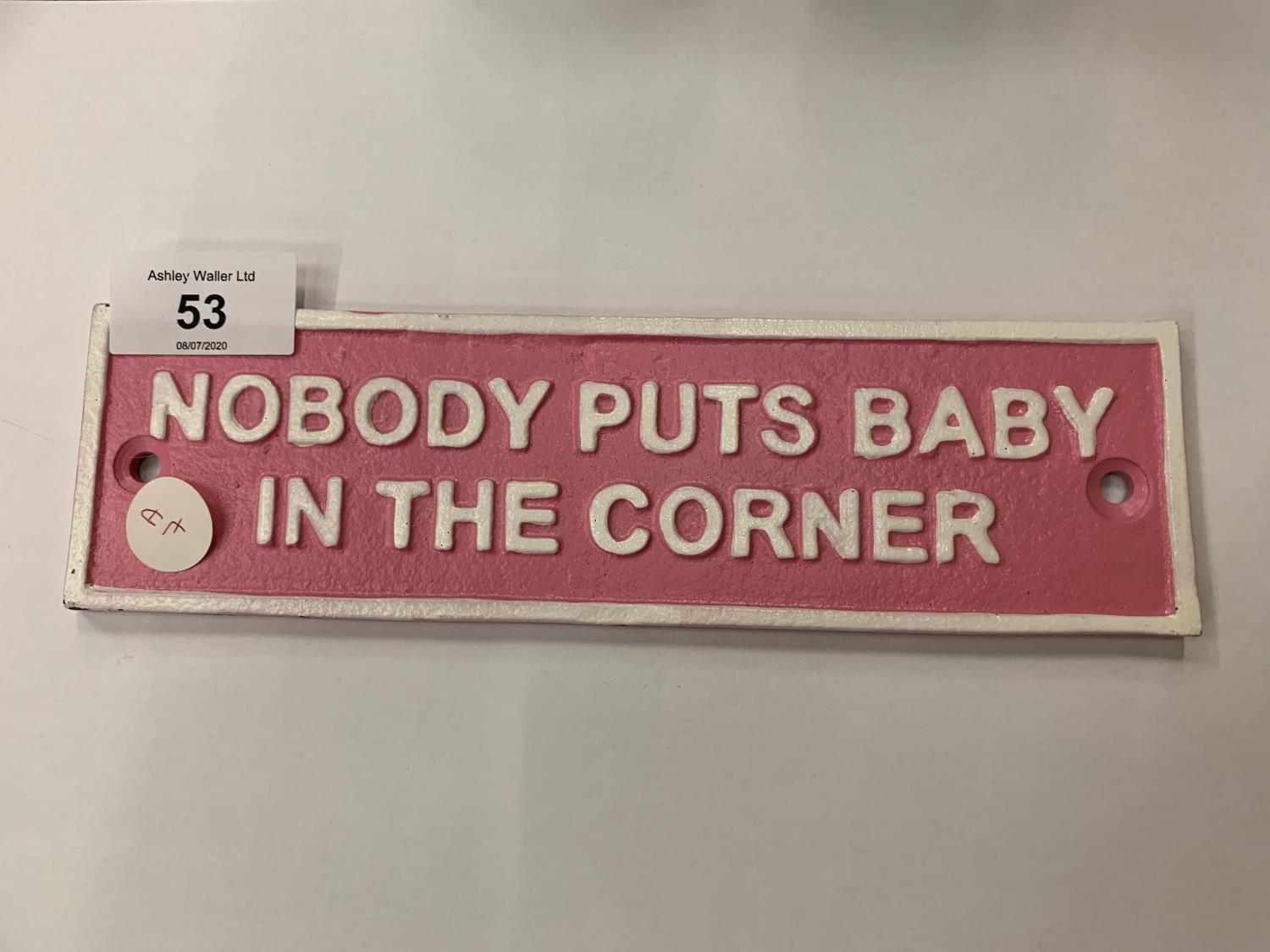 A VINTAGE STYLE 'NOBODY PUTS BABY IN THE CORNER' REPRODUCTION CAST METAL PINK SIGN 22CM