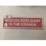 A VINTAGE STYLE 'NOBODY PUTS BABY IN THE CORNER' REPRODUCTION CAST METAL PINK SIGN 22CM