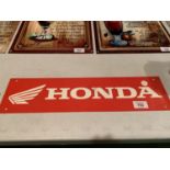 A HONDA METAL ADVERTISING SIGN