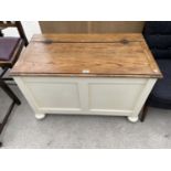 AN OAK AND PAINTED BEDDING CHEST