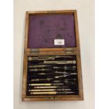 A VINTAGE WOODEN BOXED DRAWING SET