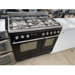 A JOHN LEWIS STAINLESS STEEL AND BLACK RANGE STYLE COOKER WITH FIVE RING GAS HOB, DOUBLE OVEN AND