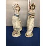 A PAIR OF 'NADAL' MARKED SPANISH FEMALE FIGURES IN THE STYLE OF LLADRO (TALLEST FIGURE 33CM)
