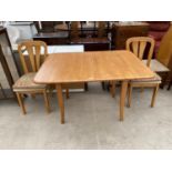 A BEECH DINING TABLE AND TWO CHAIRS