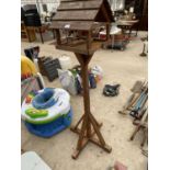 A WOODEN BIRD TABLE