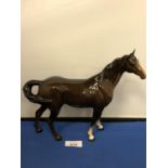 A BESWICK GLOSS BAY SWISH TAIL HORSE FIGURE LARGE, 21 CM