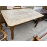 A RECTANGULAR PINE DINING TABLE