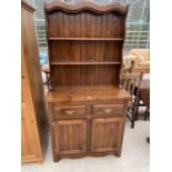 A PINE DRESSER WITH TWO DOORS, TWO DRAWERS AND UPPER PLATE RACK