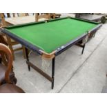 A SNOOKER TABLE ON FOLDING SUPPORTS