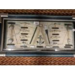A WOOD AND GLAZED CASED PICTURE WITH NAUTICAL THEMED CONTENTS