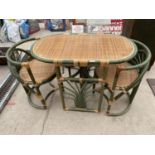 A WICKER CONSERVATORY BREAKFAST TABLE AND TWO CHAIRS