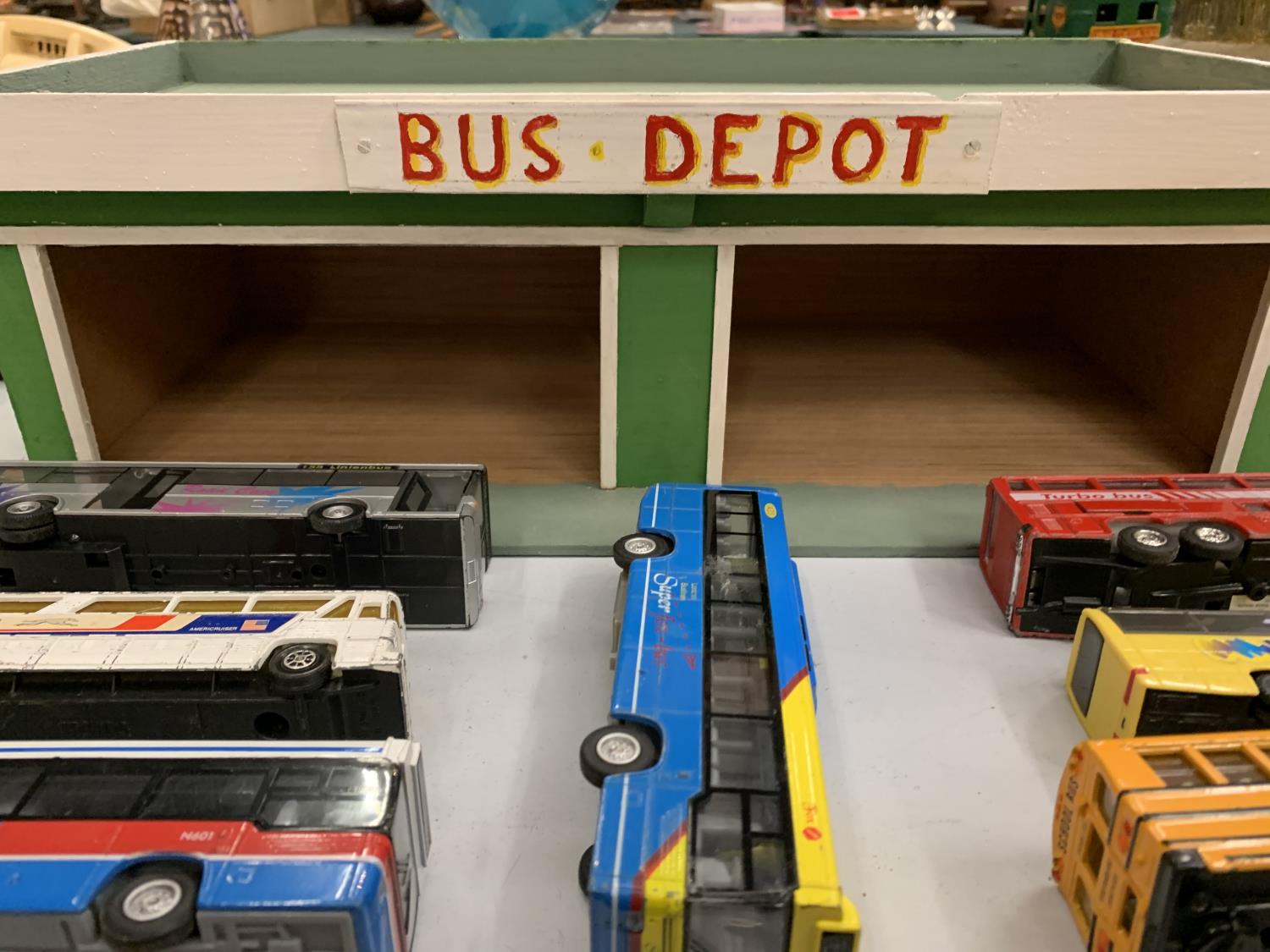 A WOODEN BUS DEPOT WITH SEVEN BUSES - Image 3 of 3