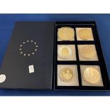 A BOXED SET OF SIX LARGE COINS, THREE OF WHICH DEPICTING THE GIFT OF CHRISTMAS, ONE OF VICTORY,