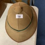 A 1950'S FOREIGN AND COMMONWEALTH ISSUED HELMET BELONGING TO GEORGE REDMAN PRISON GOVERNOR MALAWI