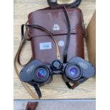 A SET OF CARL ZEISS 10 X 50W BINOCULARS WITH LEATHER CARRY CASE