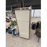 A FOUR DRAWER METAL FILING CABINET