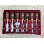 A CROWN TOOLS SEVEN PIECE BUTT CHISEL SET WITH STAINED BEECH HANDLES IN BOX - UNUSED/LITTLE USED