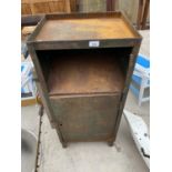 A VINTAGE METAL TWO SECTION CABINET (UPPER DOOR MISSING)