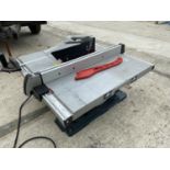 A BOSCH GTS10 240 VOLT TABLE SAW WITH TILTING BLADE, GUIDE BAR AND PUSH BAR - SOLD IN WORKING