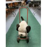 A VIC-TREE TOY DOG ON WHEELS