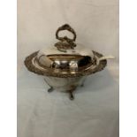 AN ORNATE SILVER PLATED TUREEN WITH A LADEL AND A W T COPELAND& SONS DISH