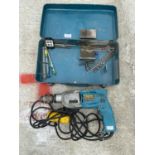 A MAKITA HP2010N 110 VOLT TWO SPEED PERCUSSION DRILL IN METAL CASE - IN WORKING ORDER