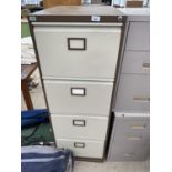 A METAL FOUR DRAWER FILING CABINET