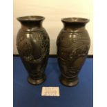 A PAIR OF ORIENTAL BRONZE VASES DEPICTING AN EAGLE HUNTING FISH A/F 15.5 CM