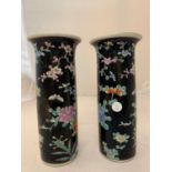 A PAIR OF CHINESE FAMILLE NOIRE CYLINDRICAL SLEEVE VASES (ONE A/F) 25 CM HIGH