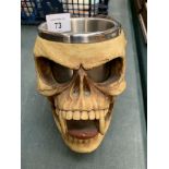 A NEMESIS SKULL WITH FANGS AND HORNS MUG