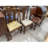 TWO OAK DINING CHAIRS AND AN OAK ARMCHAIR