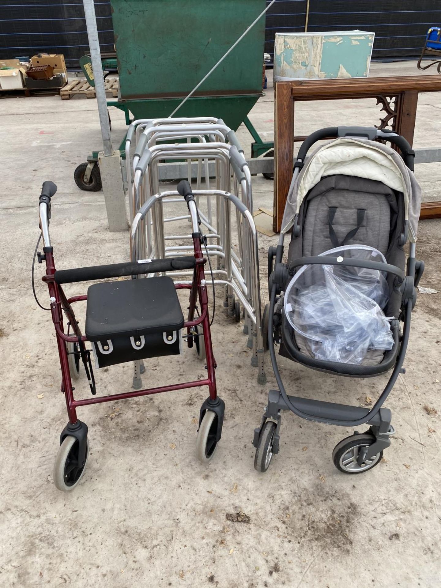 VARIOUS DISABLED WALKERS AND A PUSHCHAIR