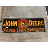 AN ENAMEL 'JOHN DEERE FARM IMPLEMENTS' SIGN