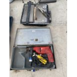 A TILE CUTTER (WORKING) AND A 110 VOLT DRILL (UNTESTED)