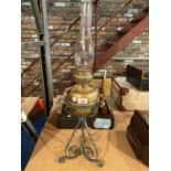 AN ARTS AND CRAFTS BRASS AND METAL OIL LAMP