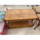 A MAHOGANY COFFEE TABLE WITH LOWER DRAWER