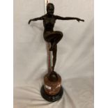 AN ART DECO STYLE BRONZE DANCING LADY ARMS OUT FIGURE ON A MARBLE BASE 52CM